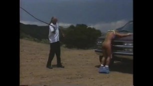 Big Tit MILF Tied to Truck and Whippped
