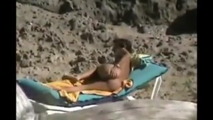 Tanned MILF Fingers her Asshole on the Beach