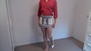 Crossdresser in tight miniskirt and pantyhose reveals more
